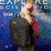 Girl carrying an Explore Scientific Backpack Carrying Case